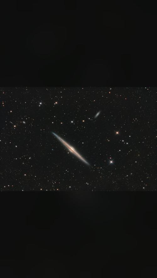 the universe is unreal 🌌 NGC 4565: Galaxy on Edge Magnificent spiral…
